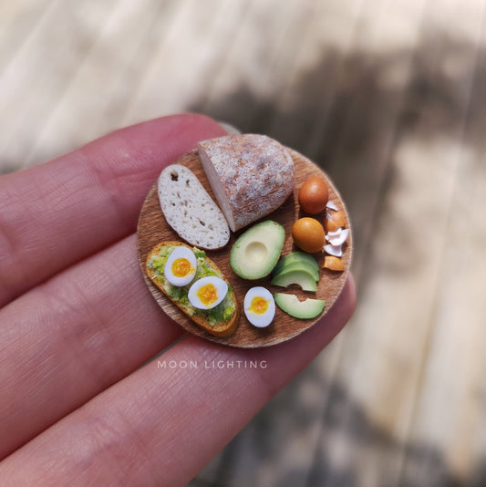 Avocado toast with eggs on round board