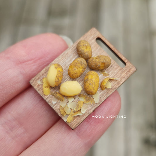 Potatoes on chopping board