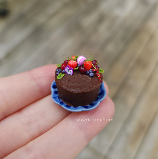 Chocolate and berry cake on blue plate