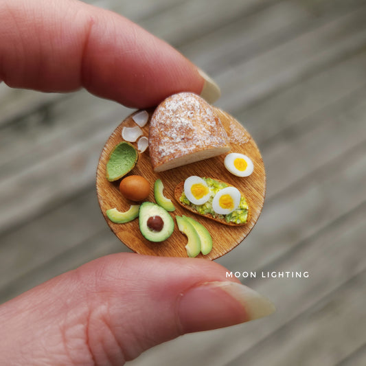 Avocado toast with eggs on round board