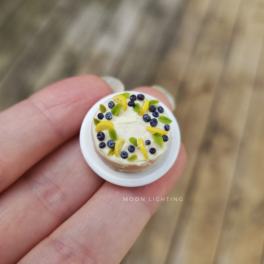 Miniature cake with lemons and blueberries
