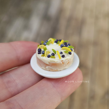 Miniature cake with lemons and blueberries