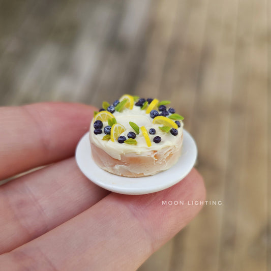 Miniature cake with lemons and blueberries